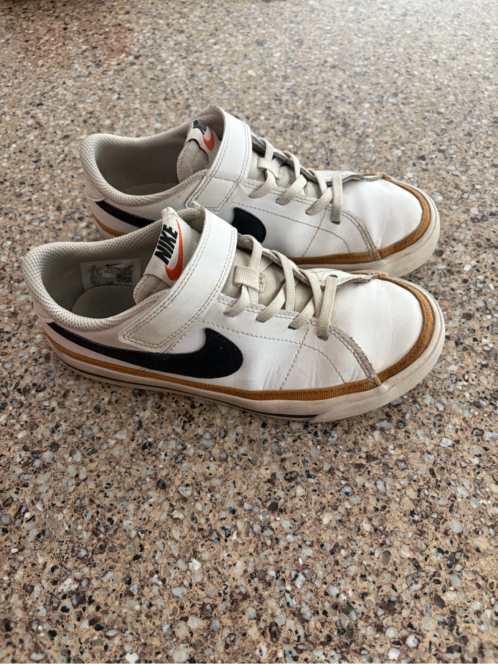Nike Kids White Sneakers with Black Swoosh and Brown Trim
